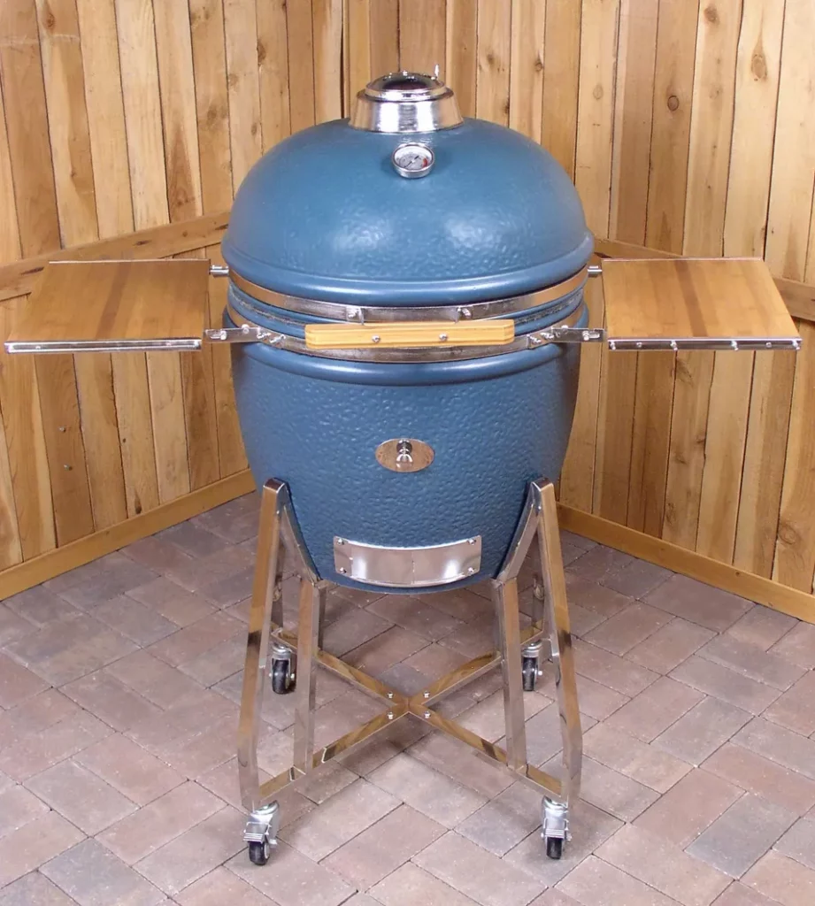 The very first Saffire Grill & Smoker, with stainless steel hardware and cart, folding side shelves with tool hooks and a port for adding smoking chips to the fire without opening the lid.