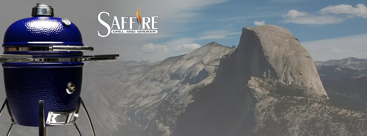 A Platinum Blue Saffire Grill Stands Prominently on the Left of the Image. In the Background is Half-Dome, at Yosemite National Park in California.