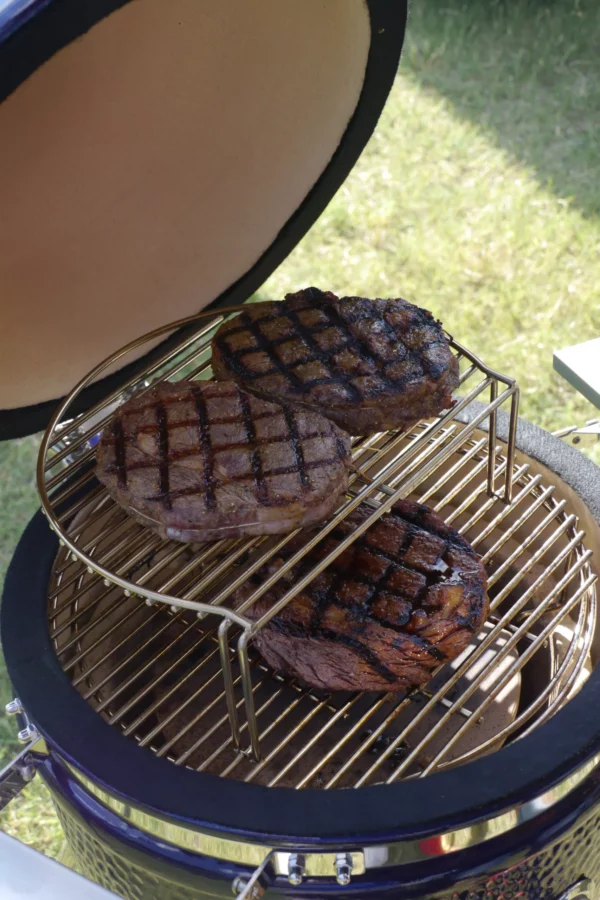 Three steaks cooking on a Medium Saffire at the 2018 SCA World Championship.