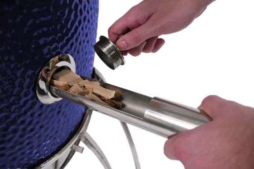 Adding smoking chips to your grill is easy with Saffire's patented Smokin' Chip Feeder, simply remove the Smokin' Chip Feeder port cap, insert the Feeder tool, and twist the tool slightly to make the chips slide in