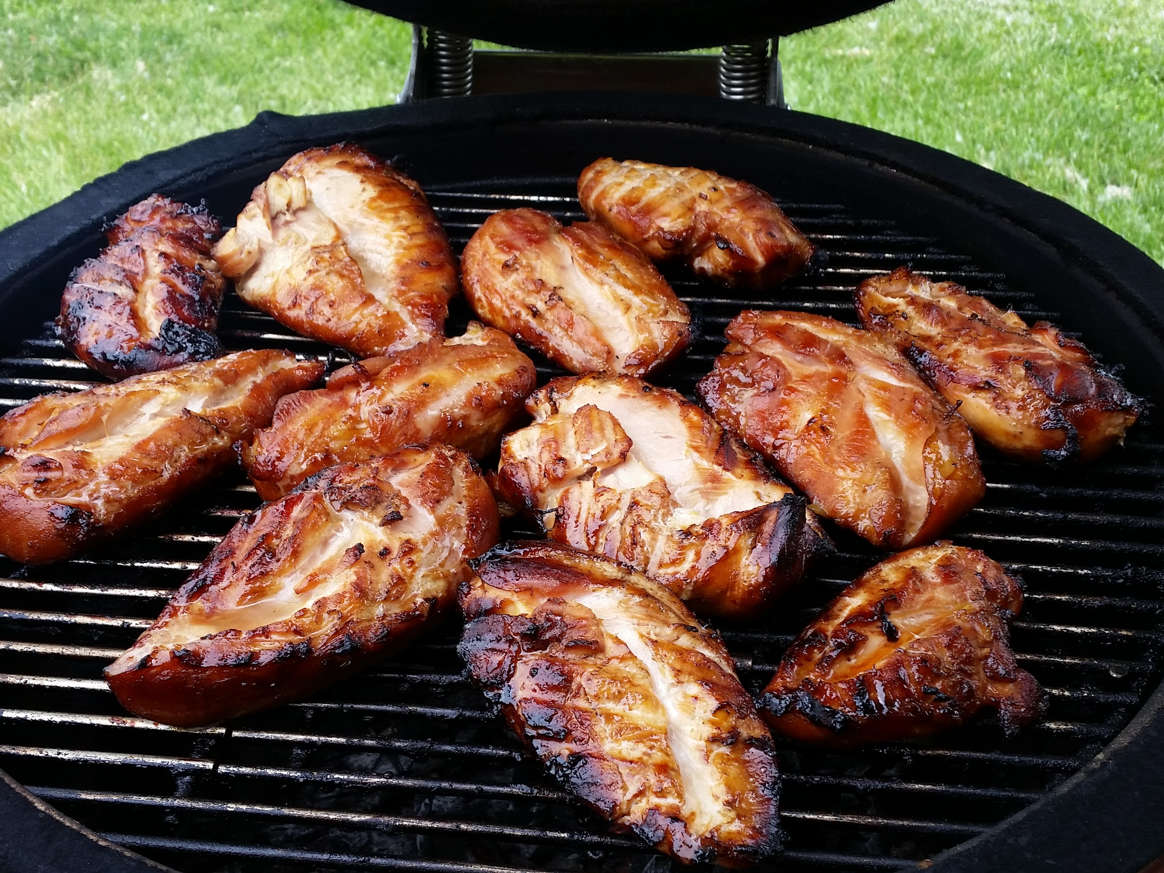 crispy chicken breasts on a grill