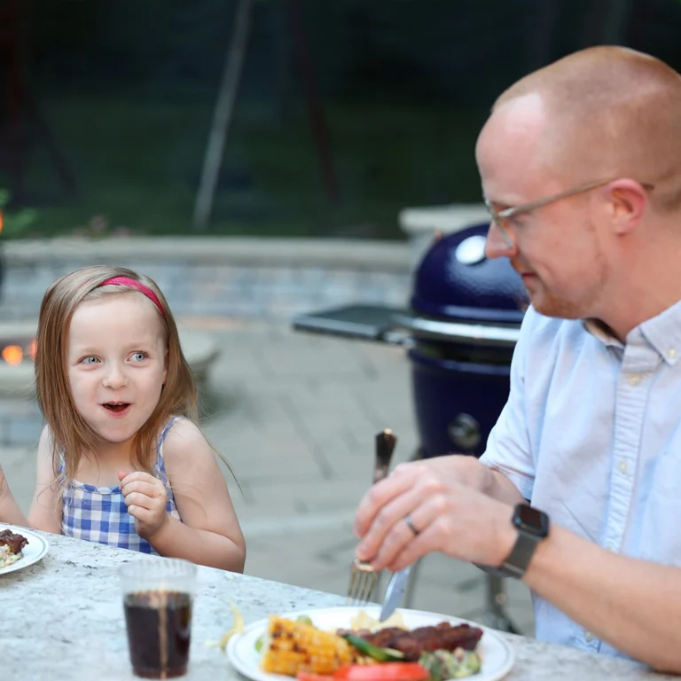 Little Girl Eating A Meal From The Saffire