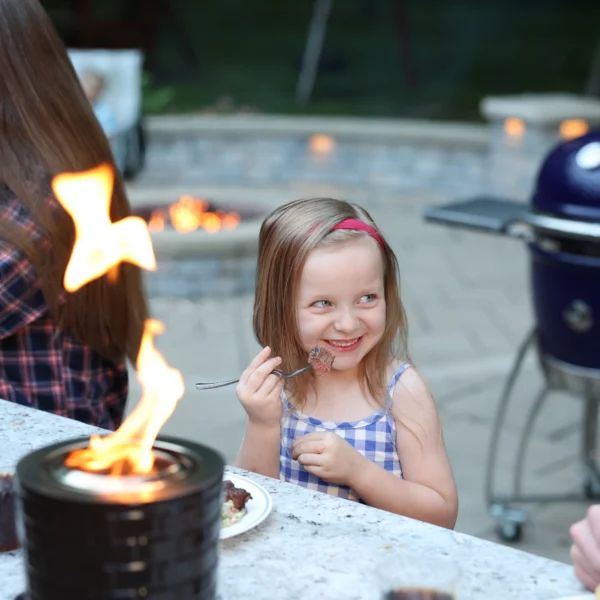 little-girl-eating-at-a-party-fire-pit