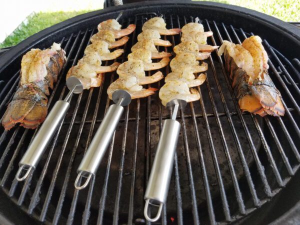 lobster-and-shrimp on a grill getting roasted