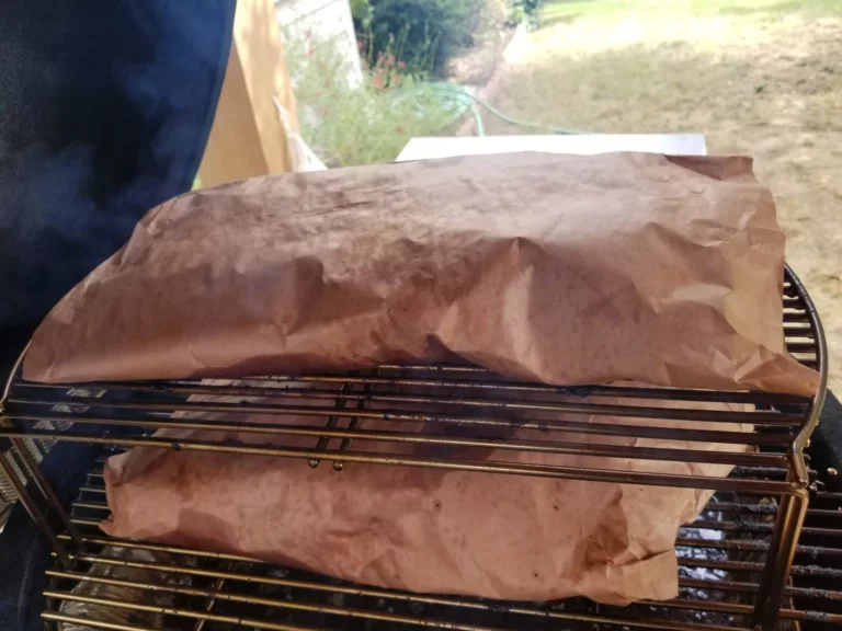 Roasted steaks covered with a wrap on a kamdo grill