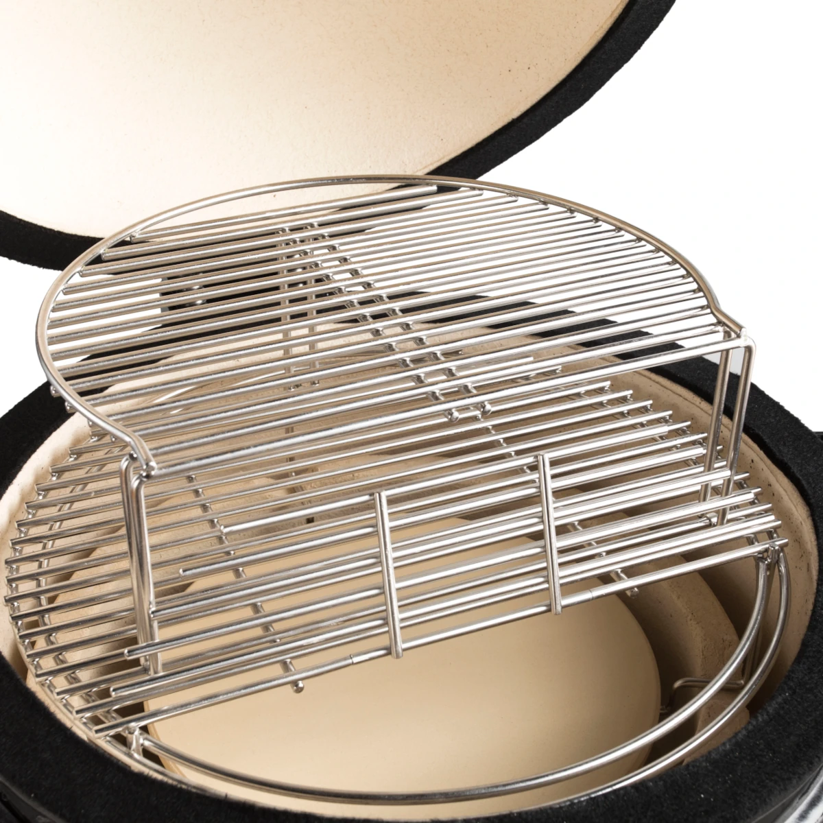 The Medium Secondary Cooking Grid with the access door to the fire on the Primary Cooking Grid up.