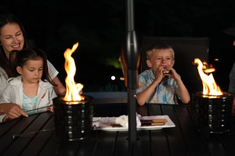 a boy sitting at a table with a man and a woman